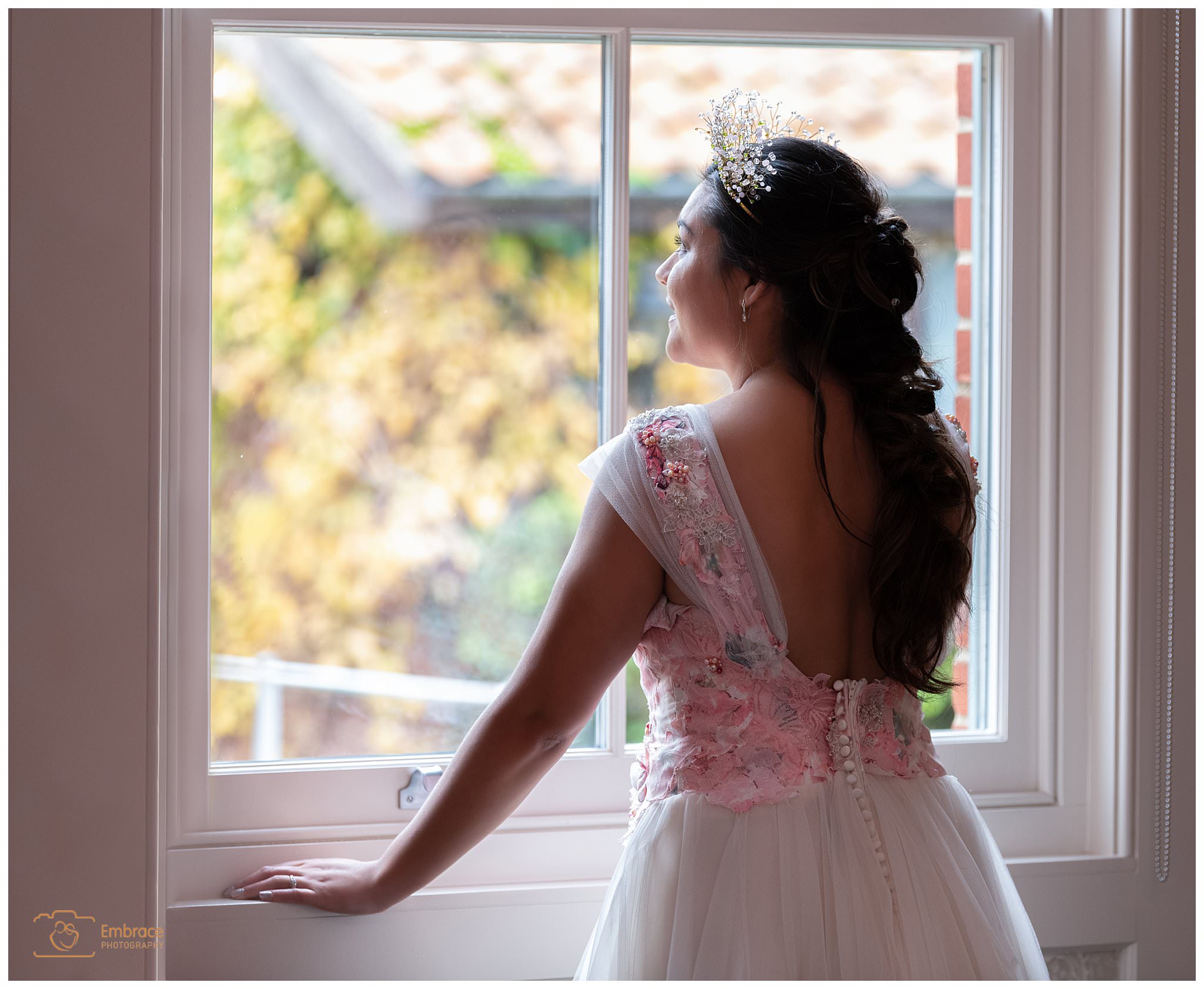 Melssa wearing a tiarra for wedding portrait with natural window light